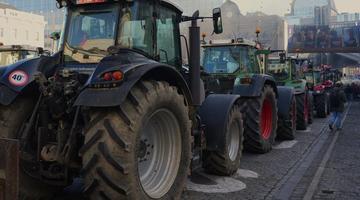 The image shoes tractors lined up during a protest in Brussels.