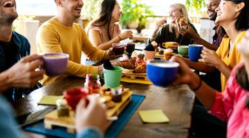 People having fun eating in a canteen